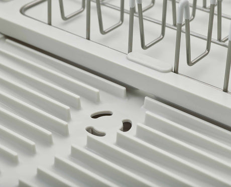 Joseph Joseph Extend Steel dish rack chopping board rail in use