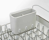 Joseph Joseph Extend Steel dish rack in stone in a kitchen setting