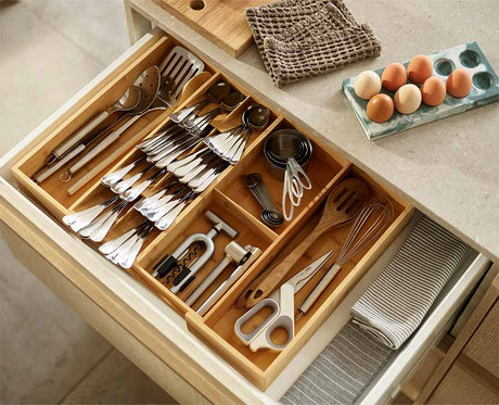 The bamboo organiser with its sides pushed out to fill the width of a drawer.