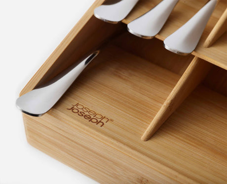 The organiser installed in an open kitchen drawer with the cutlery sorted.