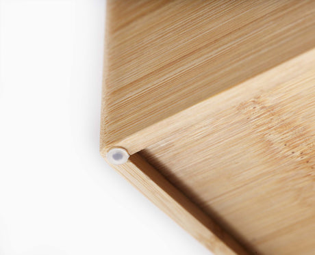 Information panel describing the tiered bamboo cutlery organiser's design.