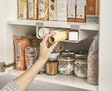 Underside view of the grey CupboardStore organiser showing both compartments.