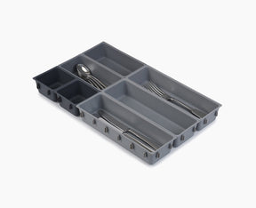 Joseph Joseph Blox 7-piece drawer organiser set in grey, clipped together as one unit.