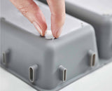 An alternative layout of the same trays organising stationery and small tools.