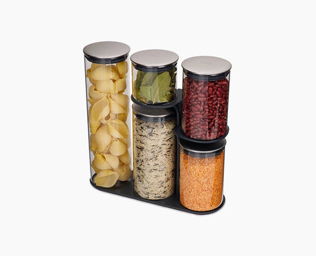 Joseph Joseph Podium set of five glass storage containers with steel lids on their stand.