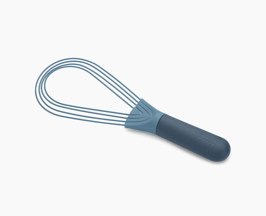 Joseph Joseph Twist 2-in-1 whisk in blue, set in its balloon whisk shape.