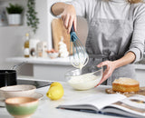 The same whisk twisted into its flat profile for blending sauces.