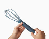 The whisk folded flat, showing how little drawer space it takes.