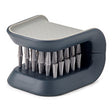 Joseph Joseph BladeBrush knife and cutlery cleaner in grey with a non-slip finish.