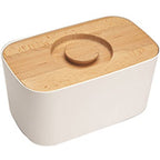 Joseph Joseph white melamine bread bin with beech wood lid, shown closed.