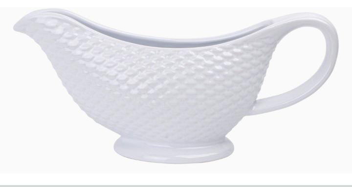 Ceramic dotted saucing jug.