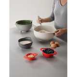 Close-up detail of the strainer from the Joseph Joseph Duo 6-Piece Food Preparation Bowl Set.