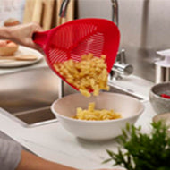Alternative angle of the Joseph Joseph Duo Easy-Pour Colander.