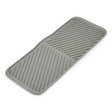 Joseph Joseph Duo foldable draining mat in grey, laid out flat.