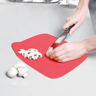 Red Joseph Joseph Duo folding chopping board measuring 32.5 by 26 cm, second product image