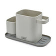 Joseph Joseph Duo Sink Tidy in dark grey, shown from the front.