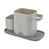 Joseph Joseph Duo Sink Tidy in dark grey, shown from the front.