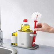 Second view of the dark grey Joseph Joseph Duo Sink Tidy sponge, brush and soap holder.