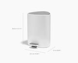 Joseph Joseph EasyStore 5L gloss white bathroom bin in a bedroom setting