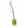 Joseph Joseph Edge glass brush with integrated sink rest in white and green.