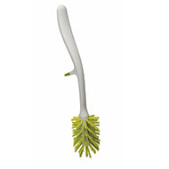 Joseph Joseph Edge glass brush with integrated sink rest in white and green.