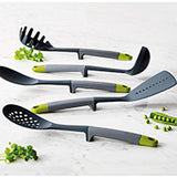 Joseph Joseph Elevate slotted turner with weighted silicone handle in grey and green, third product view.