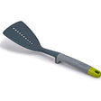 Joseph Joseph Elevate nylon slotted turner in grey and green with a weighted silicone handle.