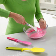 The three Elevate spatulas shown with their weighted tool rests.
