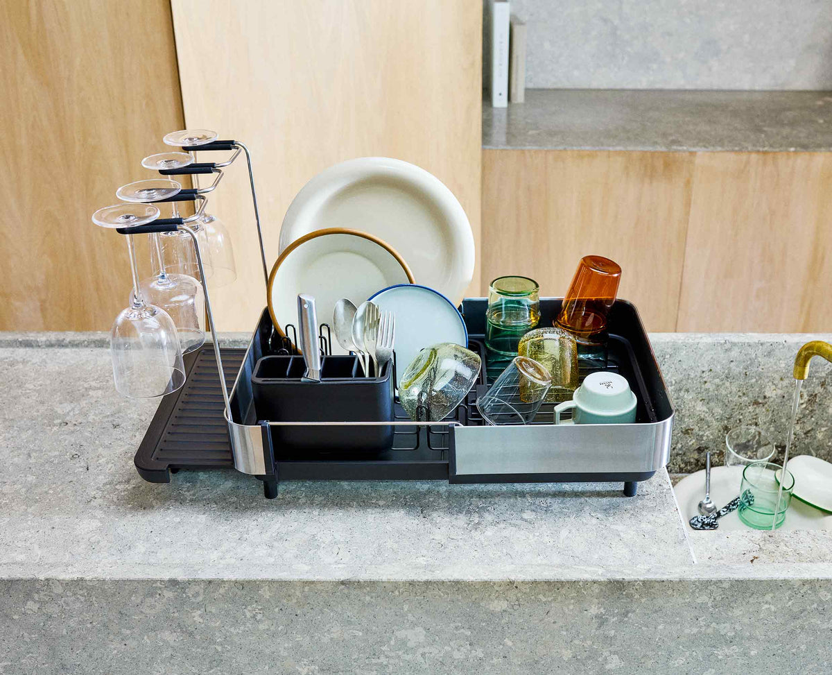 Joseph Joseph Extend Steel Plus dish rack wine glass rail in use