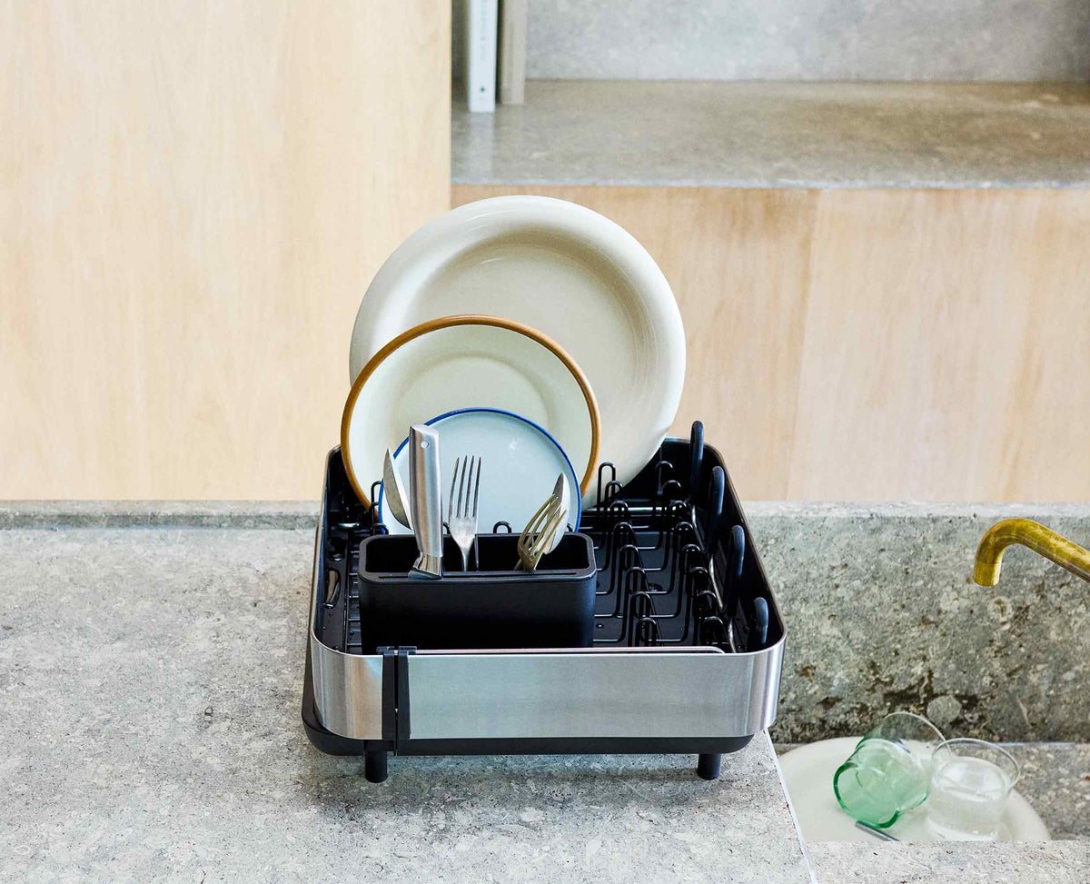 Joseph Joseph Extend Steel Plus dish rack draining spout over the sink