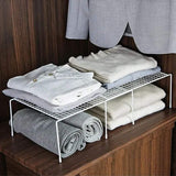 Expandable shelf raiser