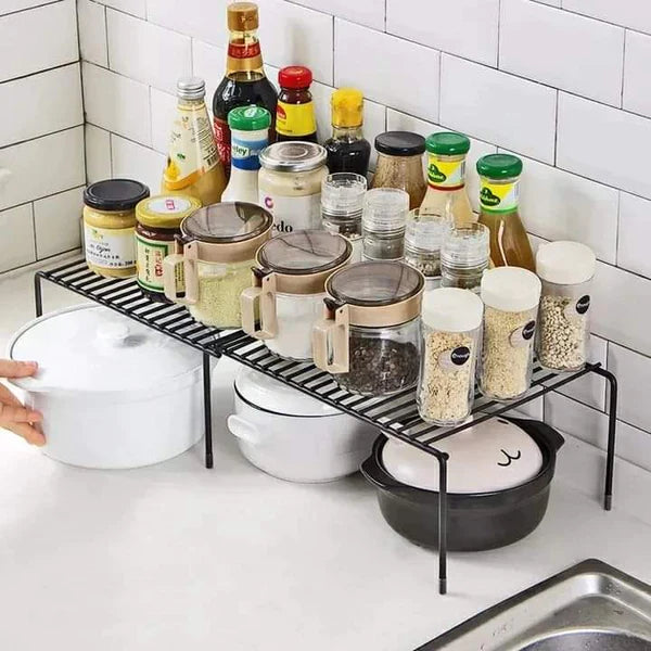 Expandable shelf raiser