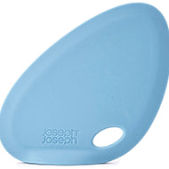 Joseph Joseph Fin silicone bowl scraper in blue, a curved self-standing spatula.