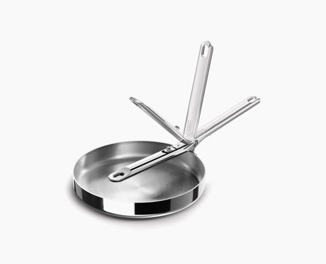 Joseph Joseph Space Steel frying pan cooking on an induction hob