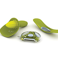 Joseph Joseph 3-piece kitchen gadget gift set in green with rocker garlic crusher, rotary peeler and citrus reamer.