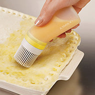 Stone-coloured Joseph Joseph Glaze refillable silicone pastry brush, second product view.