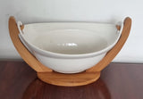 Ceramic fruit bowl on bamboo base