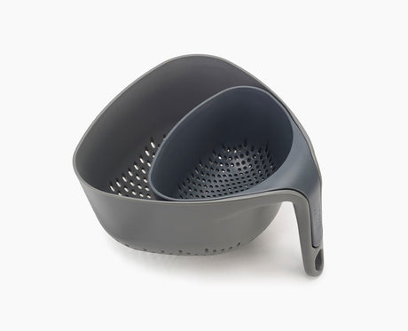 Joseph Joseph Nest 2-piece colander set in grey with the smaller colander nested inside the larger