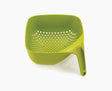 Joseph Joseph square colander in green seen from the front with its tall vertical handle