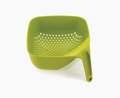 Joseph Joseph square colander in green seen from the front with its tall vertical handle