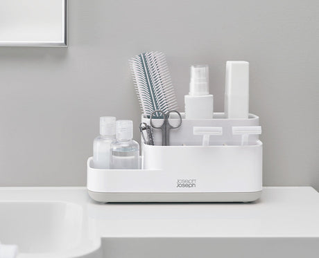 Joseph Joseph EasyStore bathroom caddy compartments filled with toothbrushes and grooming essentials