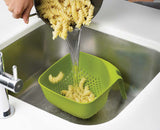 The green square colander viewed from above showing the large vertical draining holes