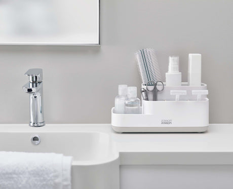 Joseph Joseph EasyStore light grey bathroom caddy on a bathroom countertop