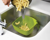 Close-up of an easy-pour square corner on the green colander