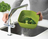 The square colander standing upright and stable on its non-tip base