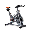 JX-7056 chain-drive spin bike in grey with orange saddle and 13kg flywheel