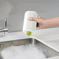 Further product view of the Joseph Joseph SinkBase Plus sink caddy set in white and green.