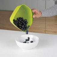 Second view of the Joseph Joseph small 15.9cm Square Colander in green