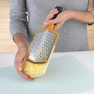Orange Joseph Joseph Twist grater with its storage sheath, second product view.