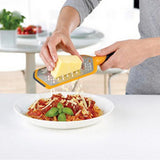 Orange Joseph Joseph Twist grater with extra coarse and ribbon blades, fourth product view.